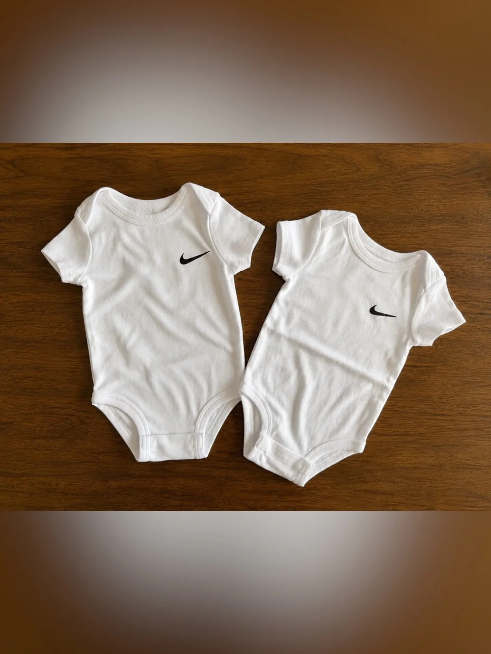 Nike White Baby Bodysuits with Black Swoosh - Twin Set
